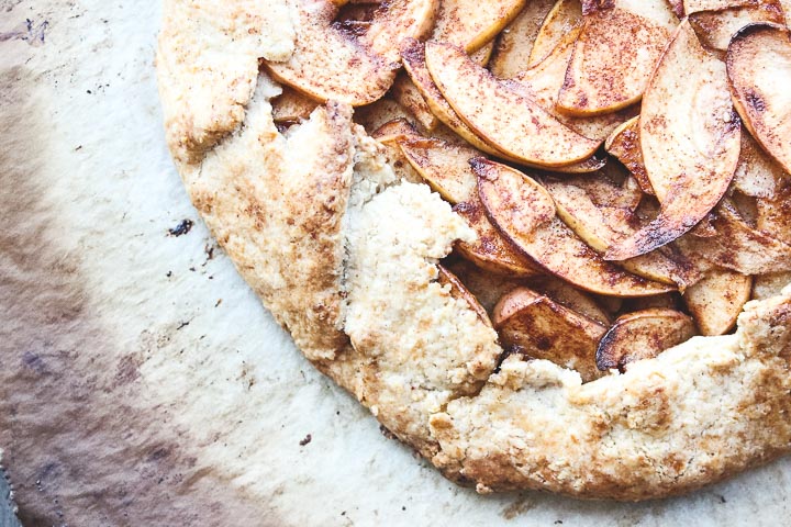 Apple galette with toasted almonds in a flaky cinnamon almond crust. Easier than pie to prepare, rustic and delicious. Perfect fall dessert!