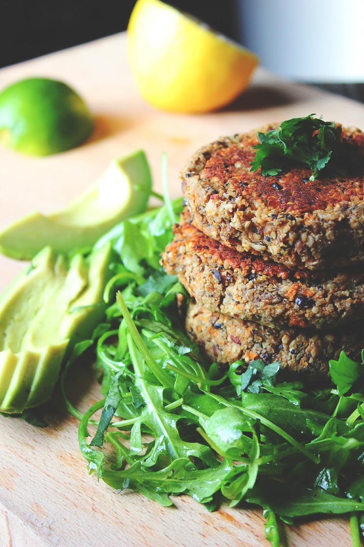 Delicious black bean burgers with sesame seeds, almonds, carrots and cumin. Vegan and gluten free. Perfect for a burger or on a salad.