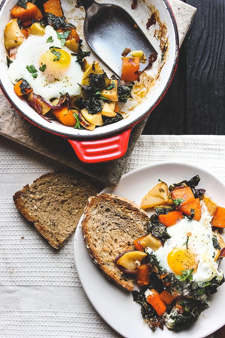 Easy baked eggs with a butternut, apple and kale hash. Perfect for a lazy Sunday brunch or quick and healthy weeknight meal.