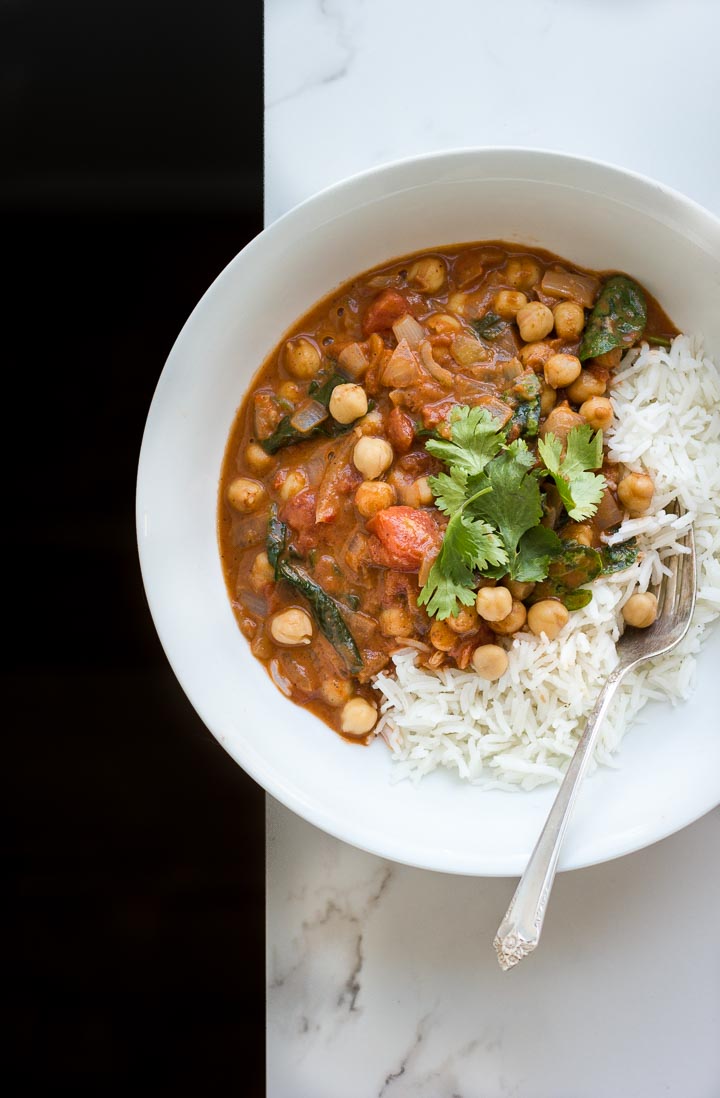 Easy, creamy, vegan chickpea masala with coconut + spinach. A simple, no fuss weeknight meal. Serves 3-4. Gluten free.