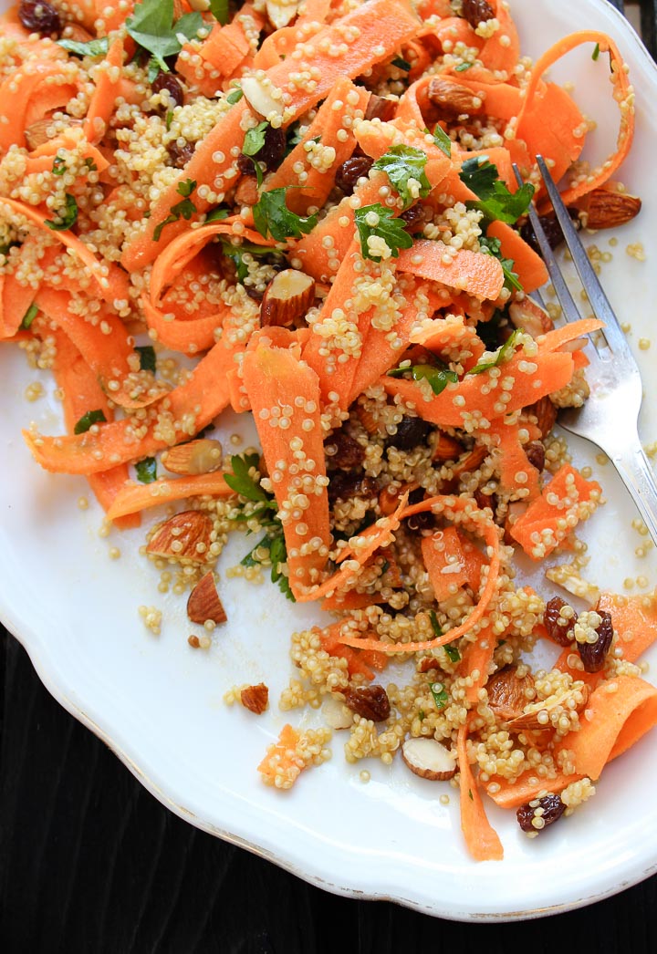 Moroccan carrot salad with spiced quinoa, raisins and almonds. A great salad for summer picnics. Vegan and gluten free. Serves a crowd.
