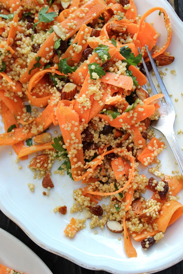 Moroccan carrot salad with spiced quinoa, raisins and almonds. A great salad for summer picnics. Vegan and gluten free. Serves a crowd.