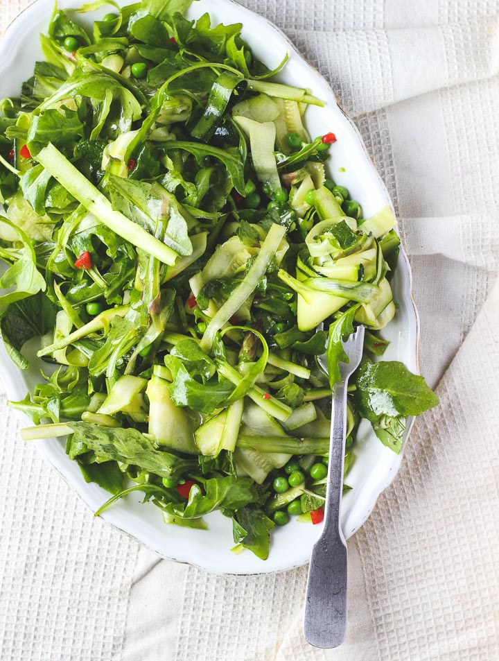 Shaved asparagus salad with zucchini, peas, chili + mint. A fresh and light spring salad to celebrate all that is green. Vegan + gluten free.