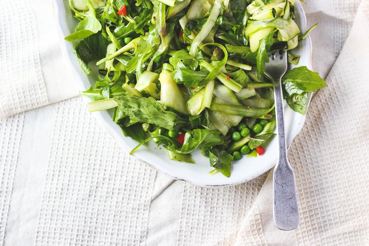 Shaved asparagus salad with zucchini, peas, chili + mint. A fresh and light spring salad to celebrate all that is green. Vegan + gluten free.