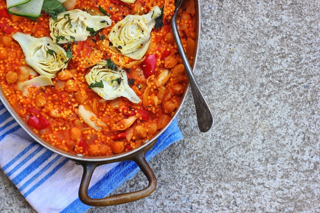 Chickpea Paella with millet, artichokes and lemon. A fresh and light vegan paella perfect for a summer's night. Vegan and gluten free.