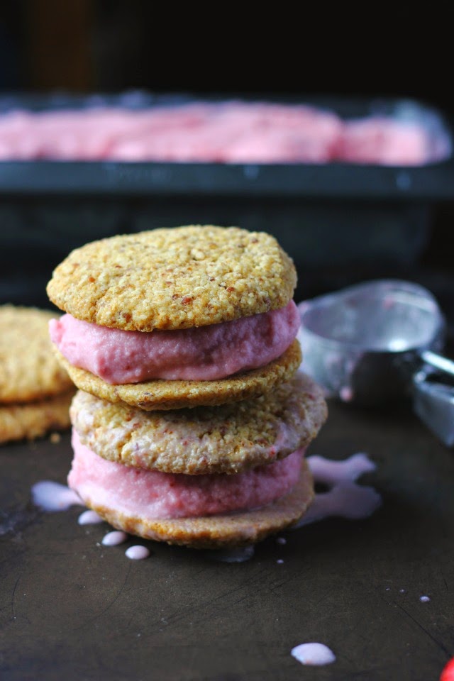 Strawberry coconut ice cream with ginger oat cookies. Vegan and gluten free. Sweetened with honey. The perfect summer treat.