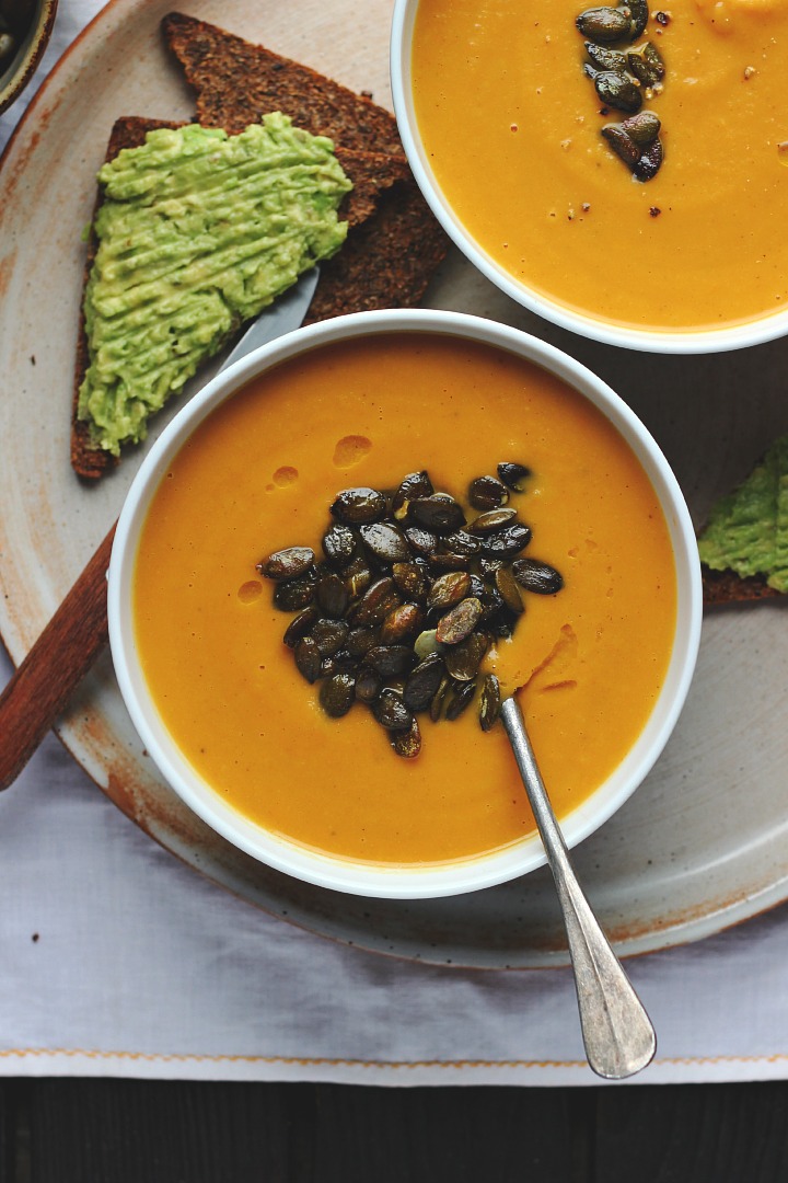 Roasted carrot soup with parsnips, apples and ginger toasted pumpkin seeds. Vegan + gluten free. Serves 6-8. 