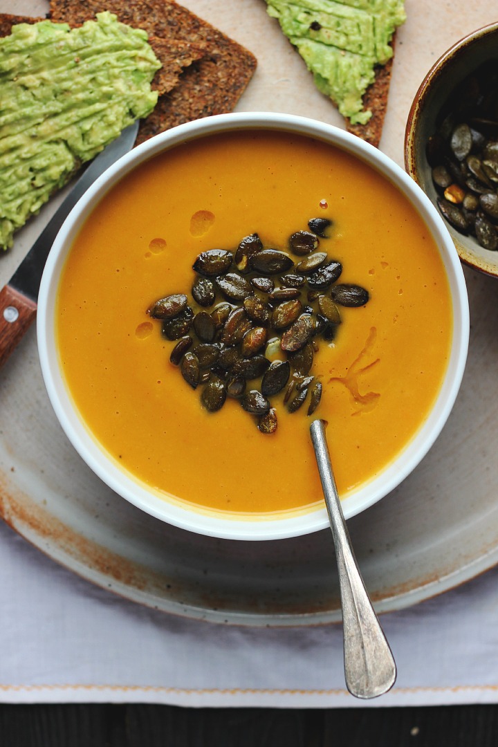 Roasted carrot soup with parsnips, apples and ginger toasted pumpkin seeds. Vegan + gluten free. Serves 6-8. 