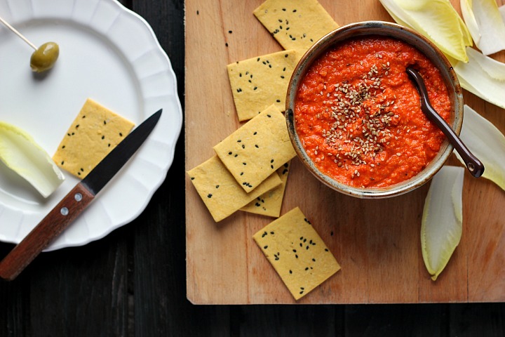 Roasted red pepper dip flavored with toasted almonds and harissa. A spicy, creamy vegan appetizer or snack that is quick and easy to prepare.