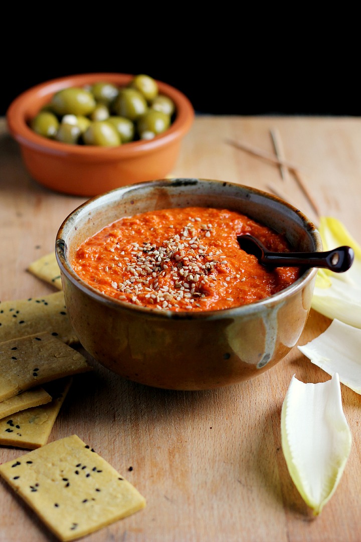 Roasted red pepper dip flavored with toasted almonds and harissa. A spicy, creamy vegan appetizer or snack that is quick and easy to prepare.
