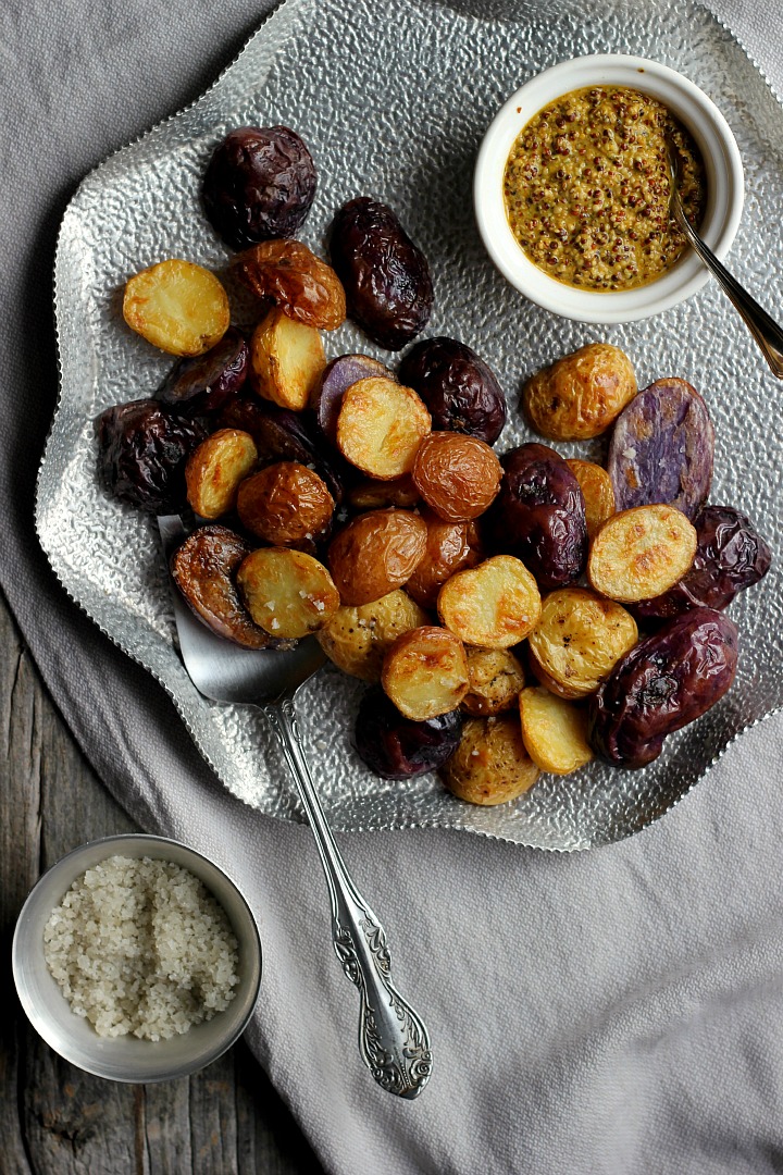 Salt and vinegar roasted potatoes with turmeric honey mustard. Crispy, salty potatoes with a delicious dip. Vegan and gluten free.