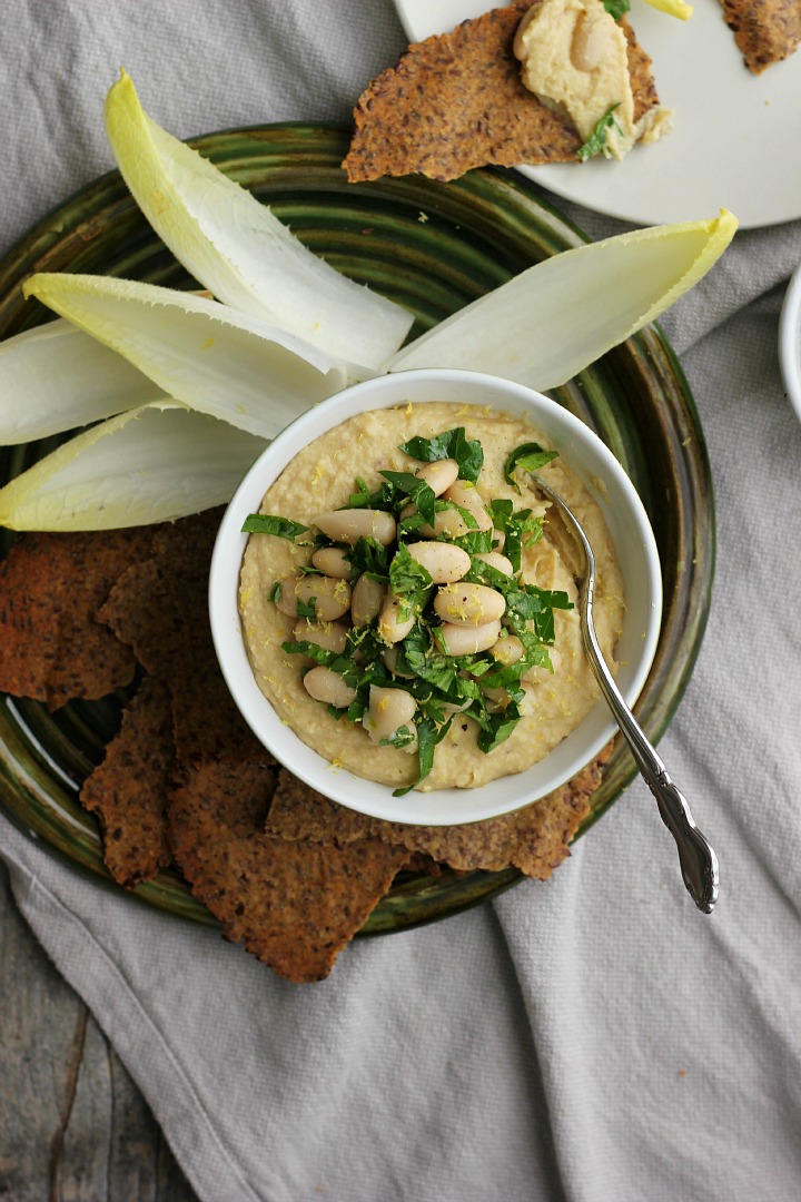Creamy vegan white bean dip with roasted golden beets and shallots. Easy gluten free crackers made with flax seeds and brown rice flour.