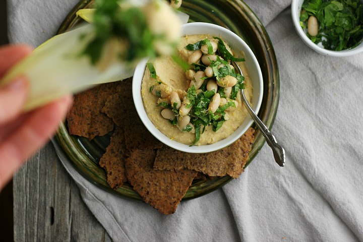Creamy vegan white bean dip with roasted golden beets and shallots. Easy gluten free crackers made with flax seeds and brown rice flour