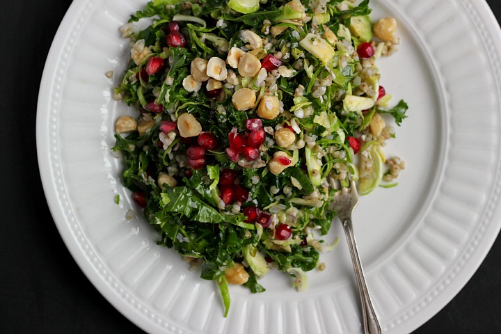 Winter slaw with buckwheat, toasted hazelnuts, pomegranate seeds and a tamari almond butter dressing. Vegan and gluten free.