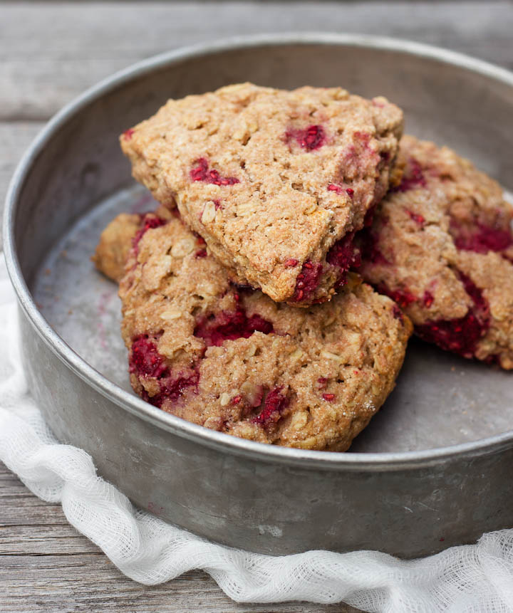Raspberry Oat Scones made with whole grain flour and sweetened with honey. Vegan. Makes 6 scones. The perfect summer treat!