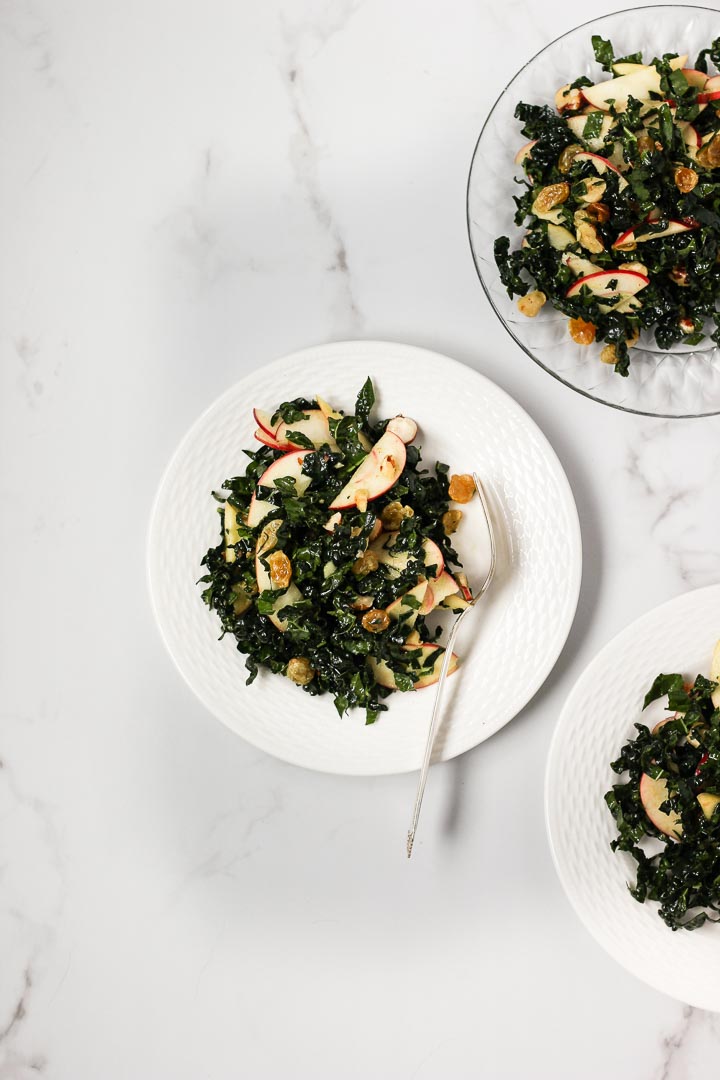 Holiday Kale Salad with Apples, Soaked Golden Raisins and Spiced Cider Dressing