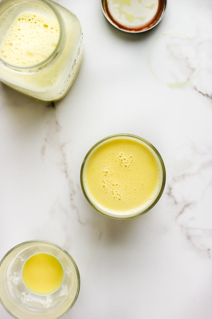 Homemade almond turmeric milk with cinnamon, ginger and honey. Turn the leftover pulp into granola and it's sunshine in a bowl. Vegan + gluten free.