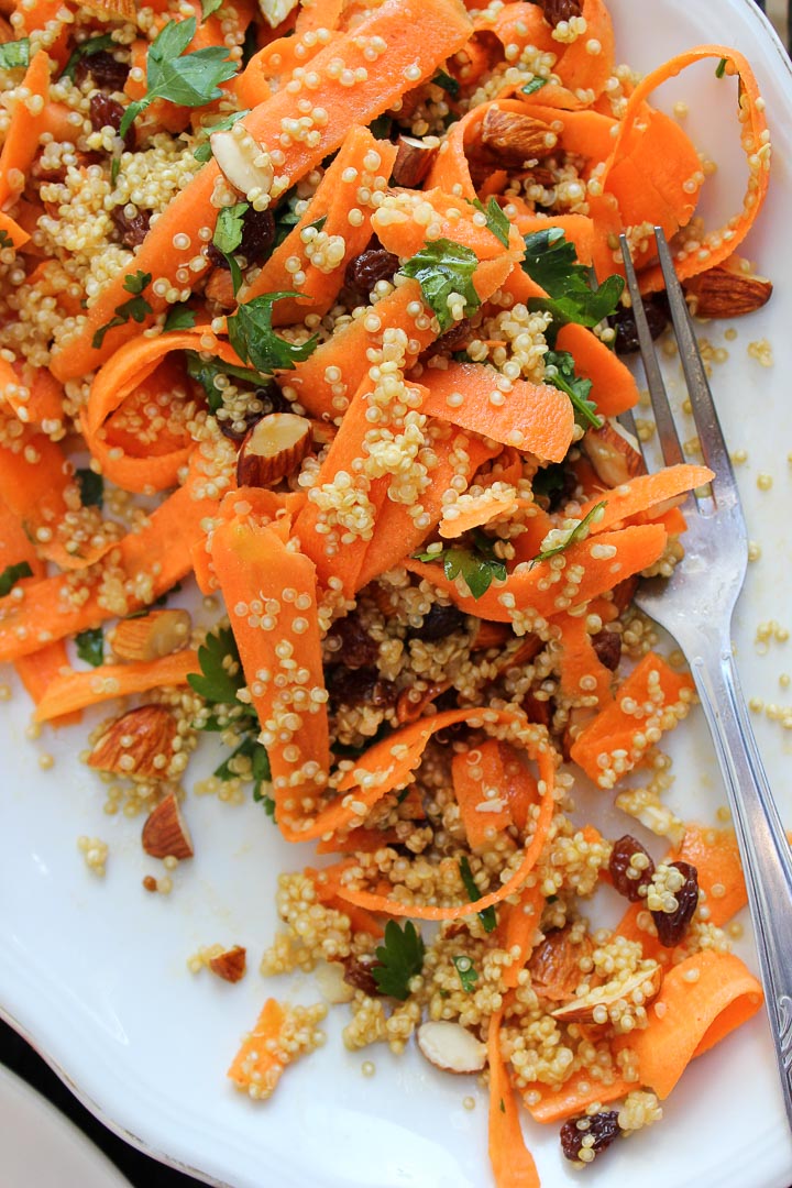 Moroccan carrot salad with spiced quinoa, raisins and almonds. A great salad for summer picnics. Vegan and gluten free. Serves a crowd.