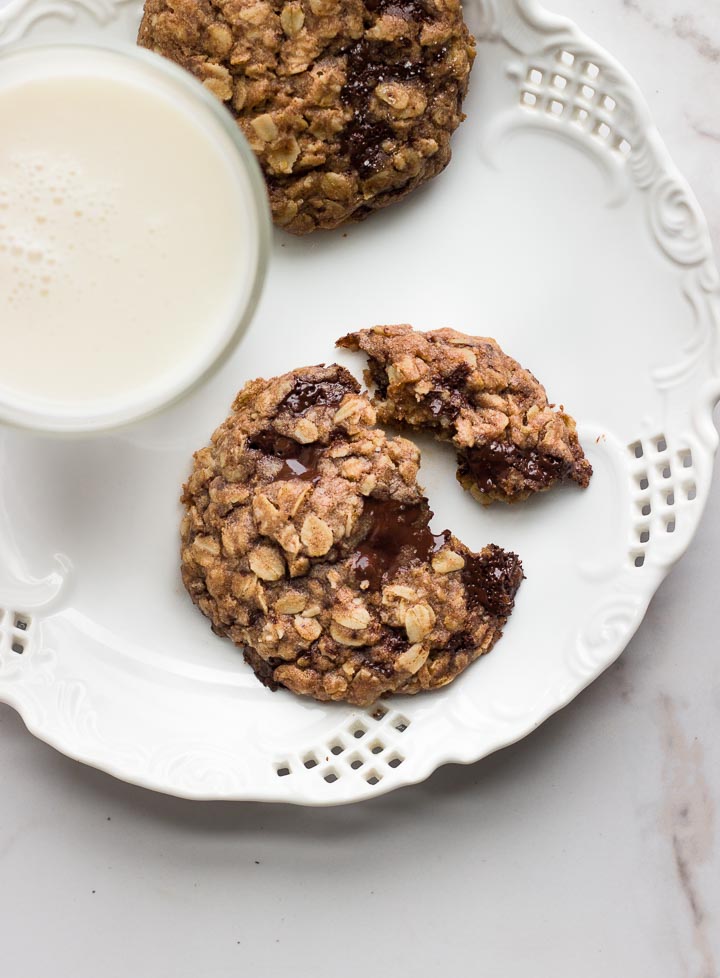 Easy vegan oatmeal cookies that are 100% maple syrup sweetened, made with whole spelt flour and rolled oats and loaded with melted chocolate chunks.