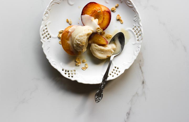 Easy, creamy vegan oat milk ice cream made with oats, vanilla and honey. Served with grilled peaches and honey toasted oats.