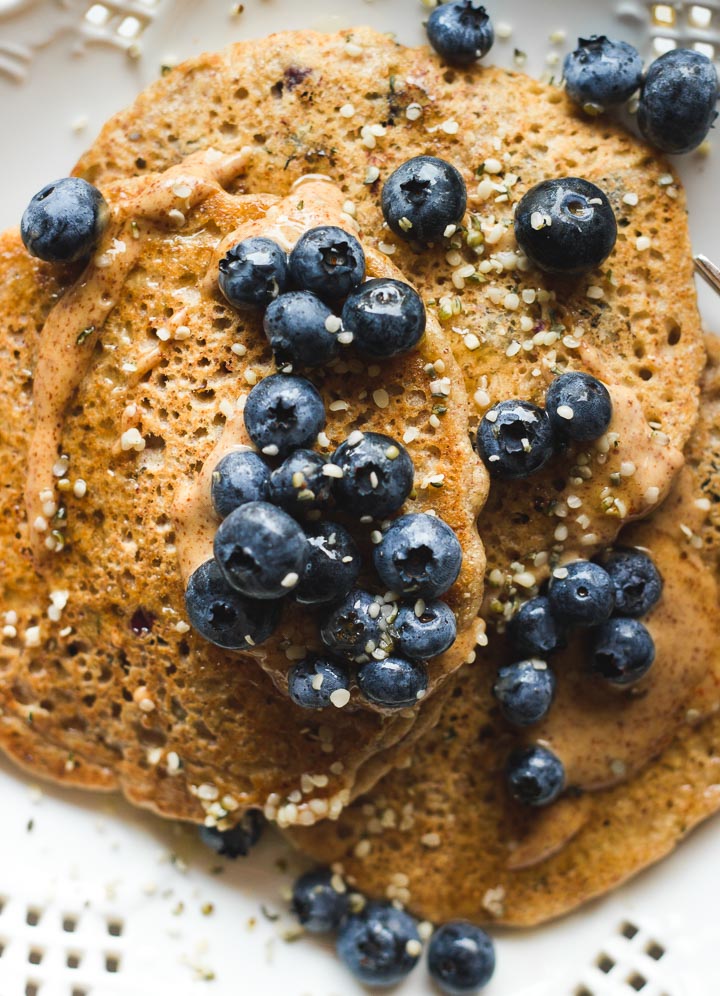 Easy almond butter pancakes packed with buckwheat, oats, hemp seeds and almond butter. Vegan and Gluten Free for a plant powered breakfast.