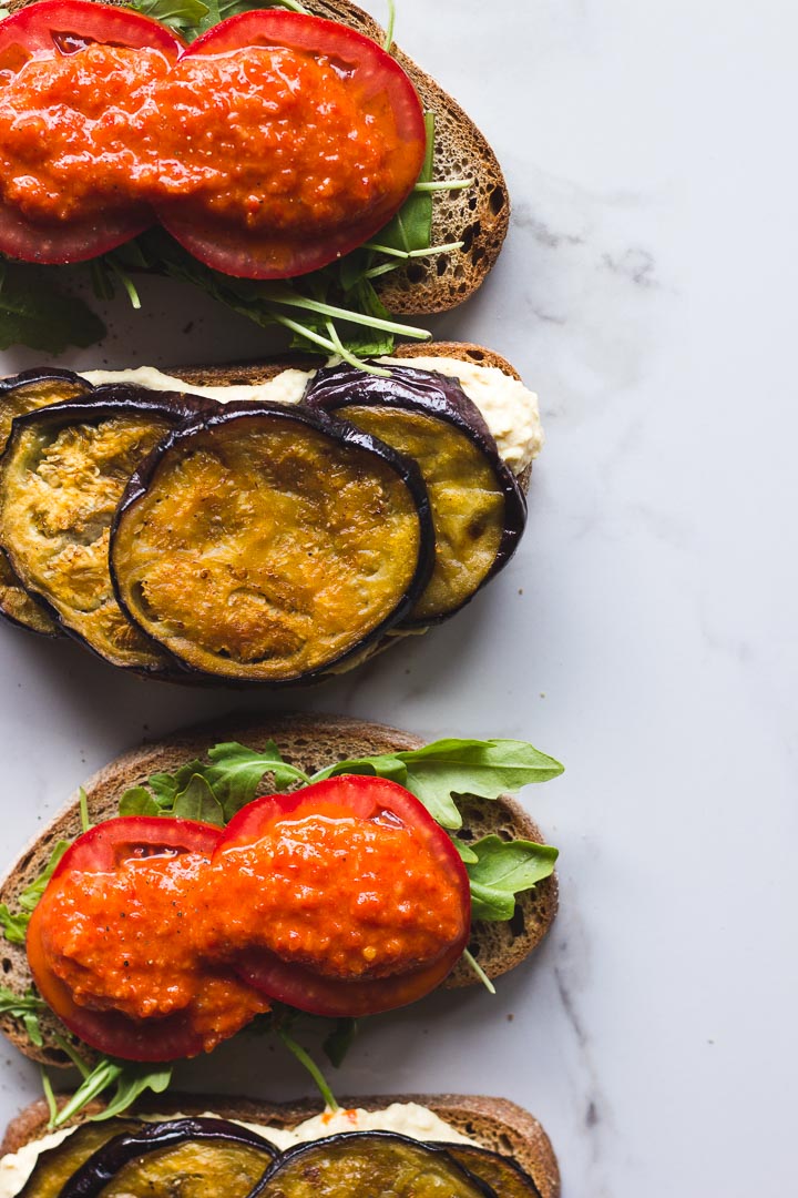 Vegan roasted eggplant sandwich with hummus and harissa relish. Made with Mina harissa. Simple, quick and easy for lunch or on the go.